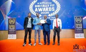 Raymond Nduga receiving the tech and law winners awards